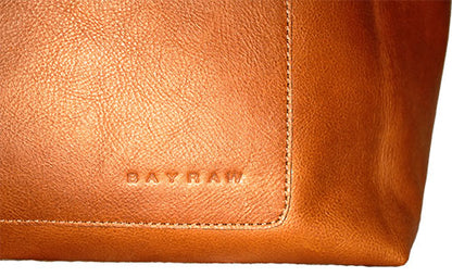 The Leather Tote by Bayraw, close up of Bayraw logo